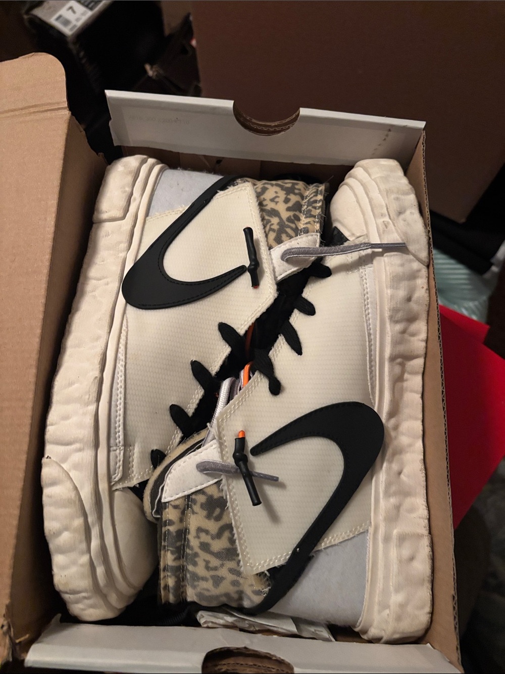 Nike Cream High-Top Sneakers with Black and Orange Accents